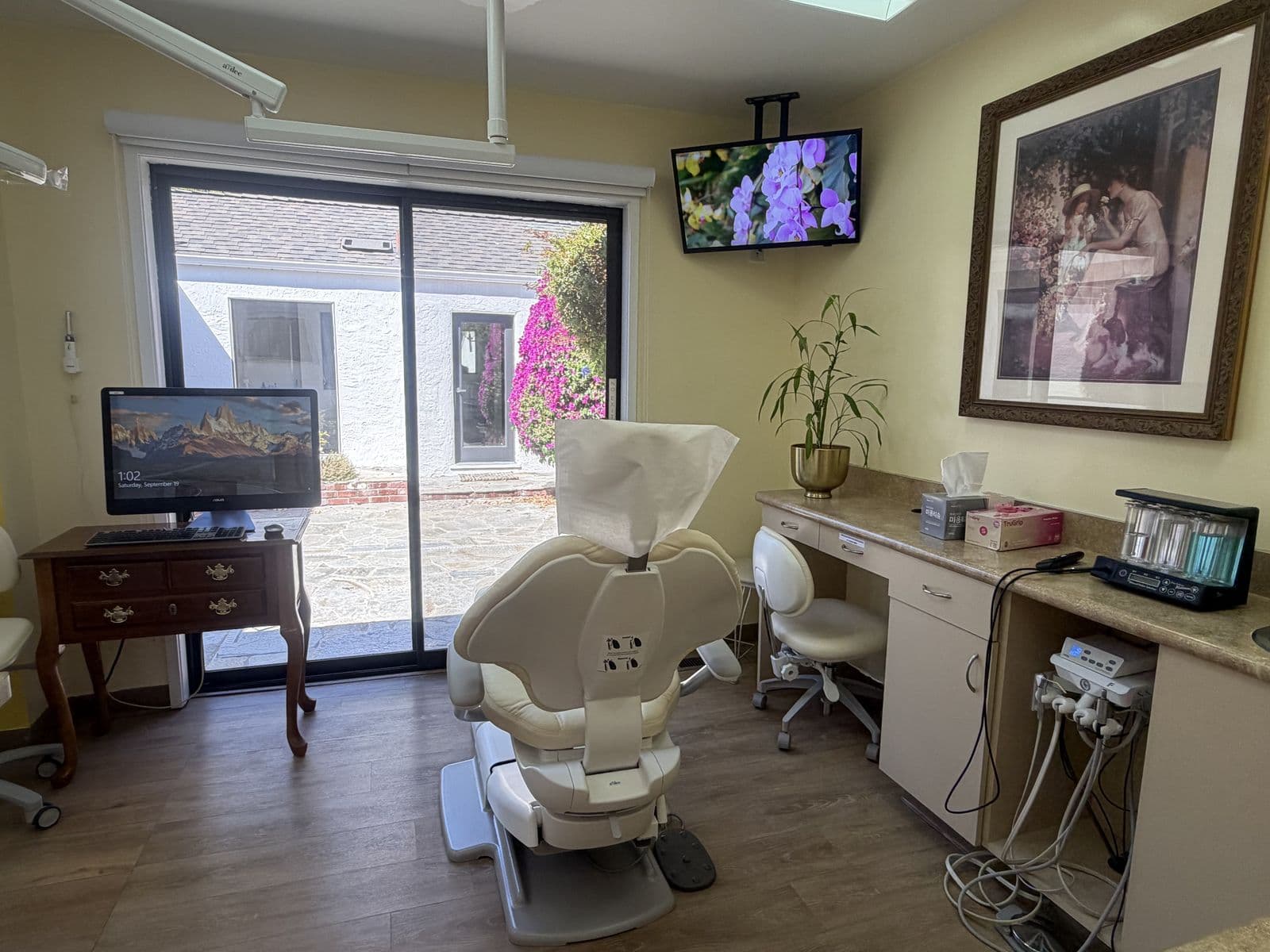 Treatment room with a dental chair and garden view